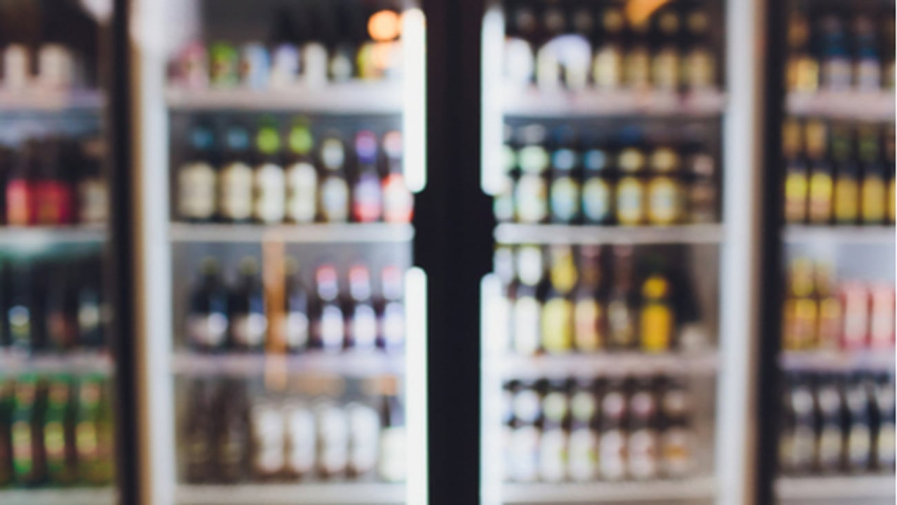 Background Blurred Defocused Beers are cooling in fridge, freezer or refrigerator shelf. Defocused Blurry Night life, Night Club, Bar, Pub, Store or Grocery