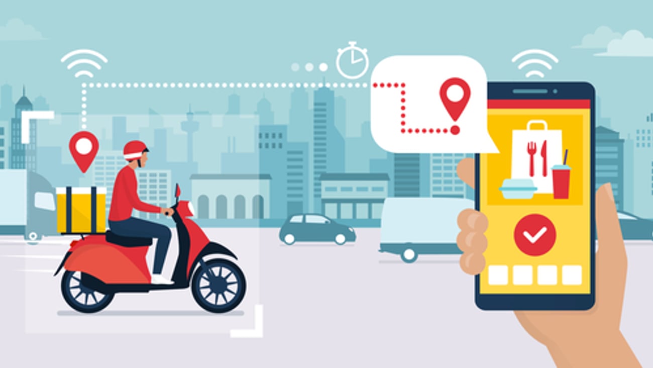 Food delivery app on a smartphone tracking a delivery man on a moped with a ready meal, technology and logistics concept, city skyline in the background