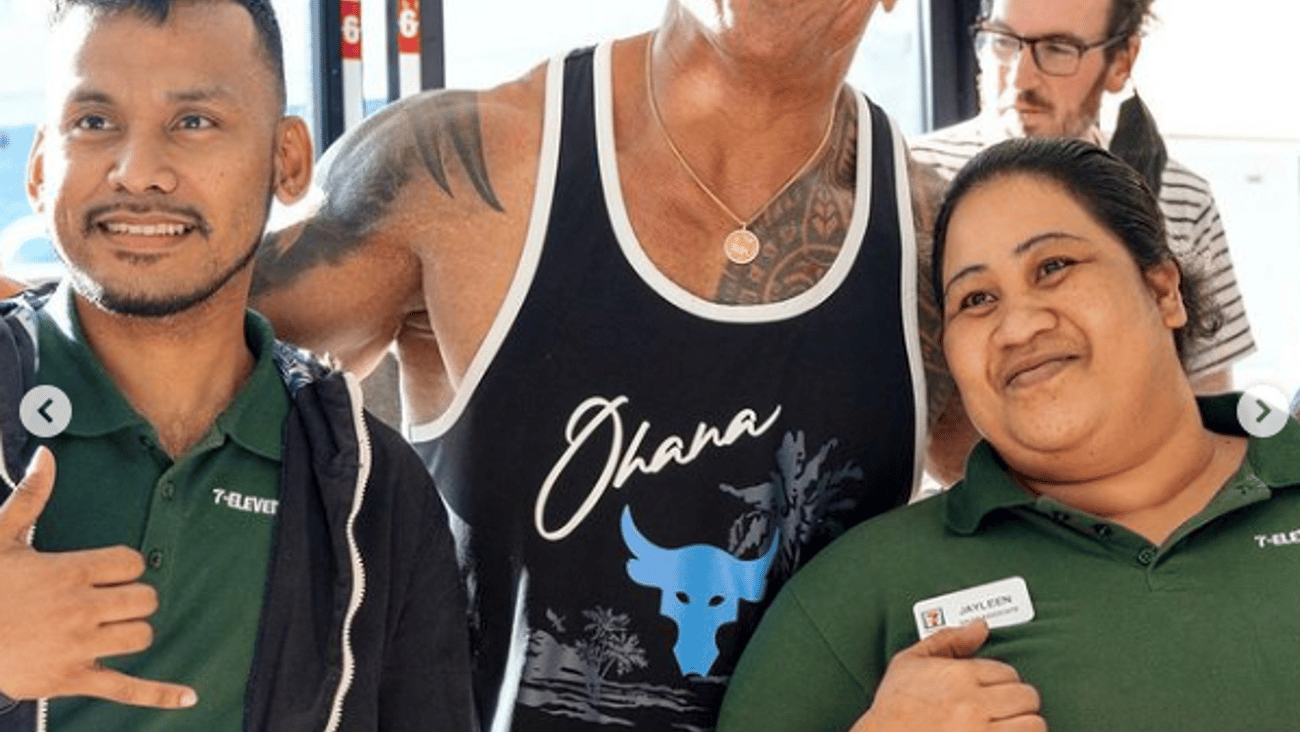 The Rock poses with 7-Eleven employees