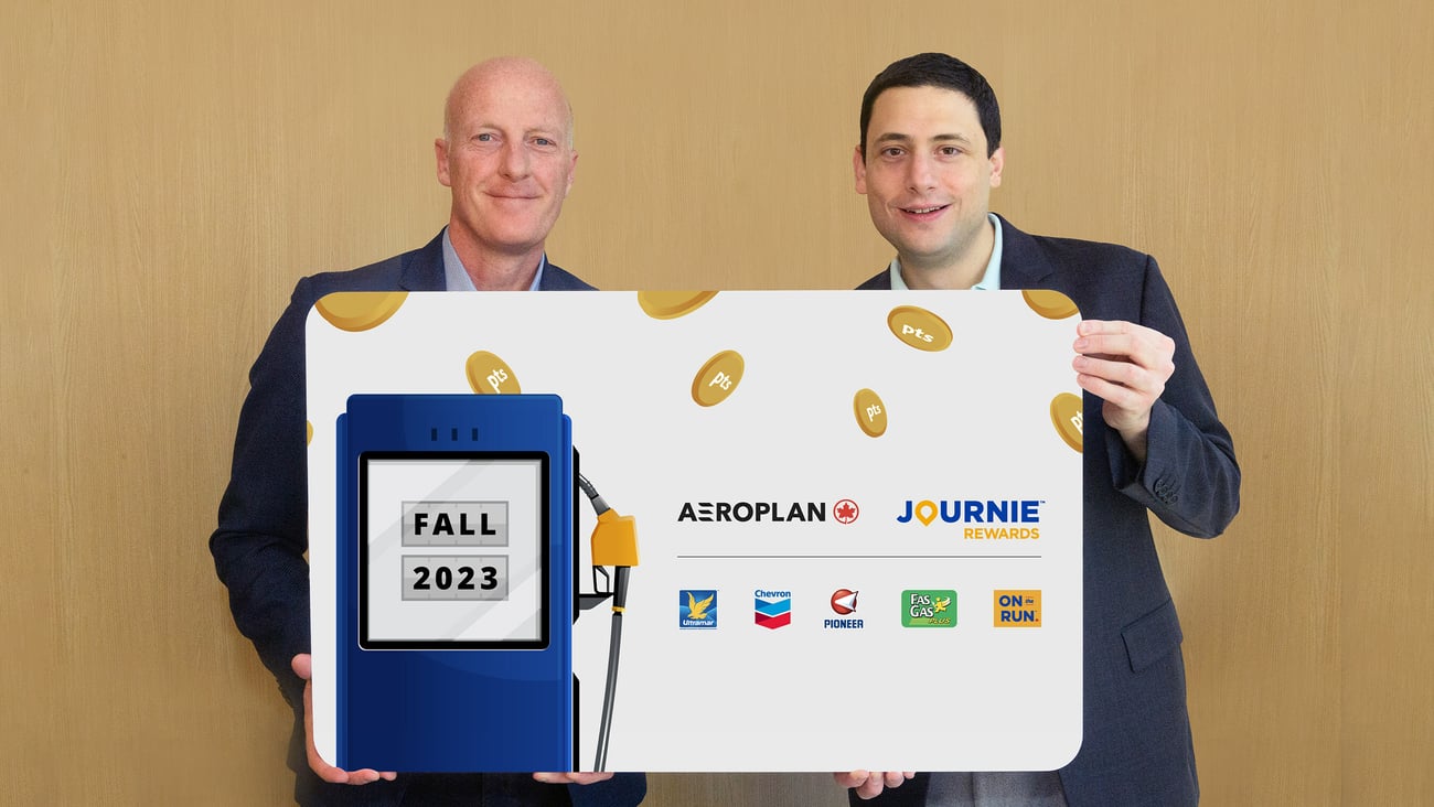 Parkland and Aeroplan CEOS holding big cheque