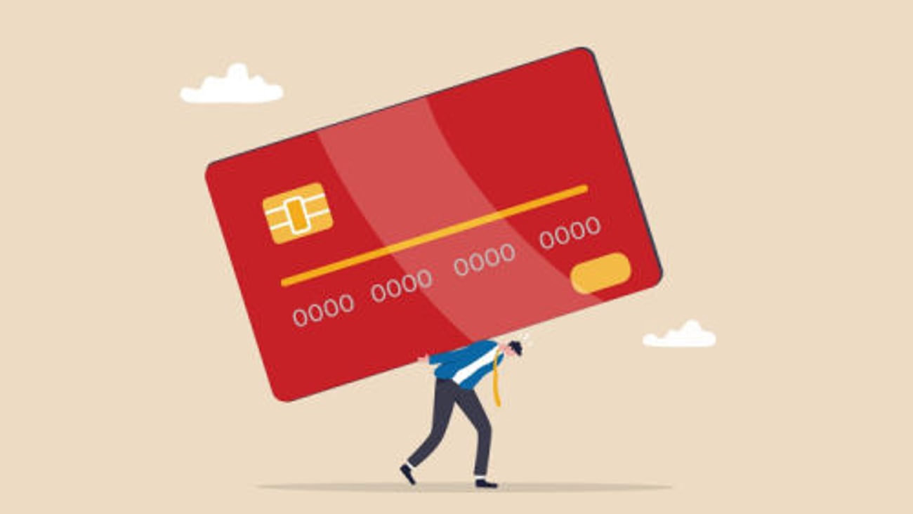 Credit card debt, financial problem, loan or obligation to pay back, over spending or expense, money trouble or despair concept, frustrated businessman carry credit card debt burden or loan payment.