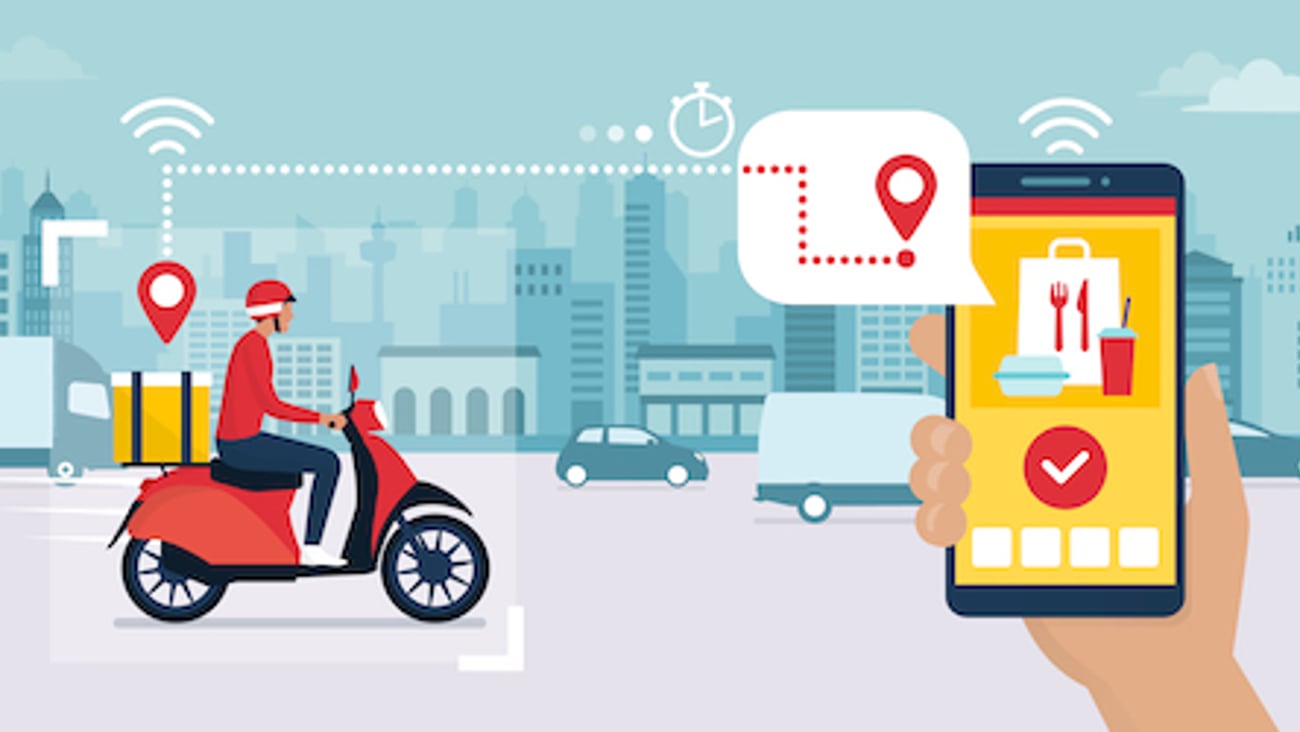 Food delivery app on a smartphone tracking a delivery man on a moped with a ready meal, technology and logistics concept, city skyline in the background