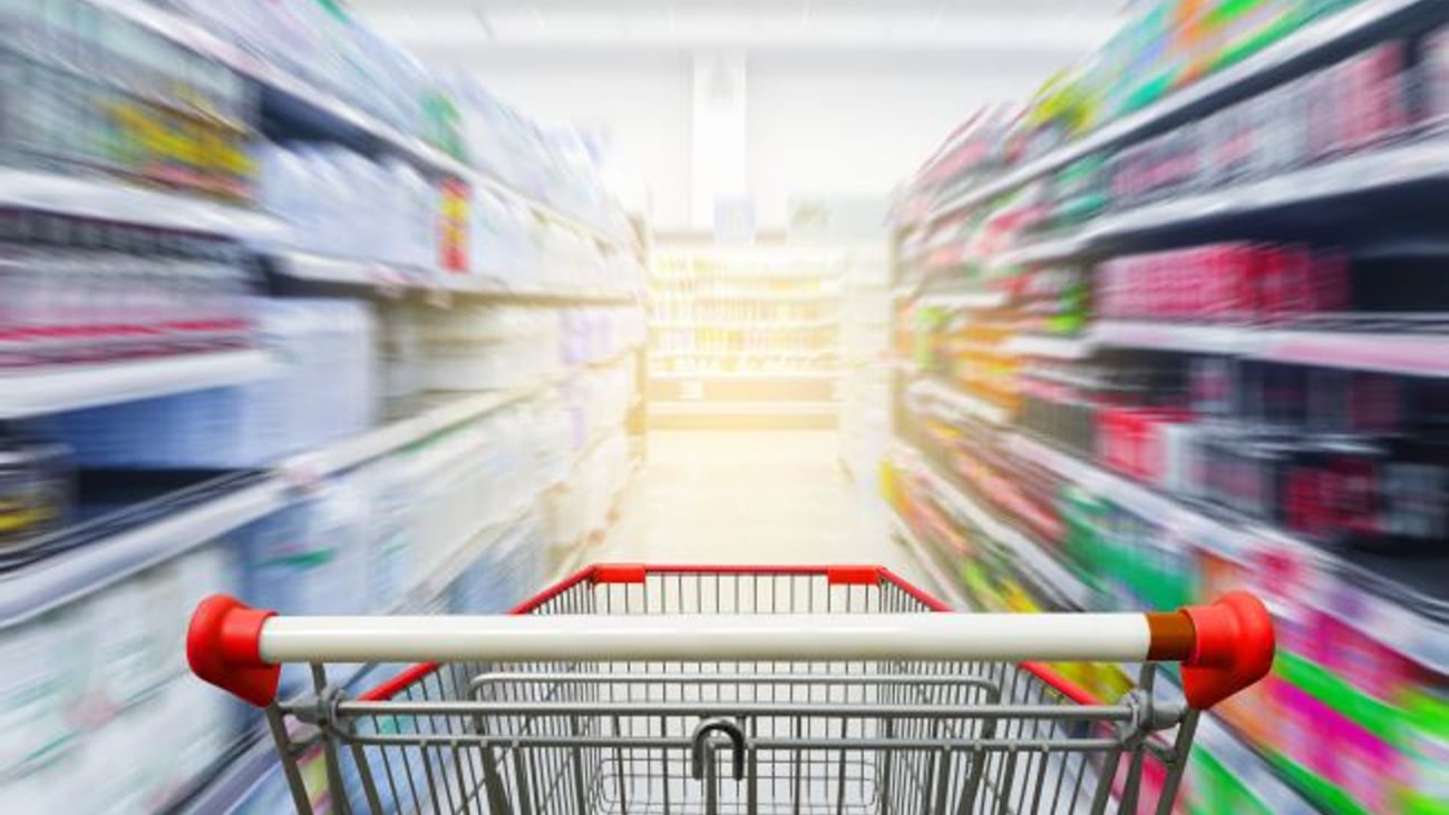 Blurred Shopping Lane with Cart
