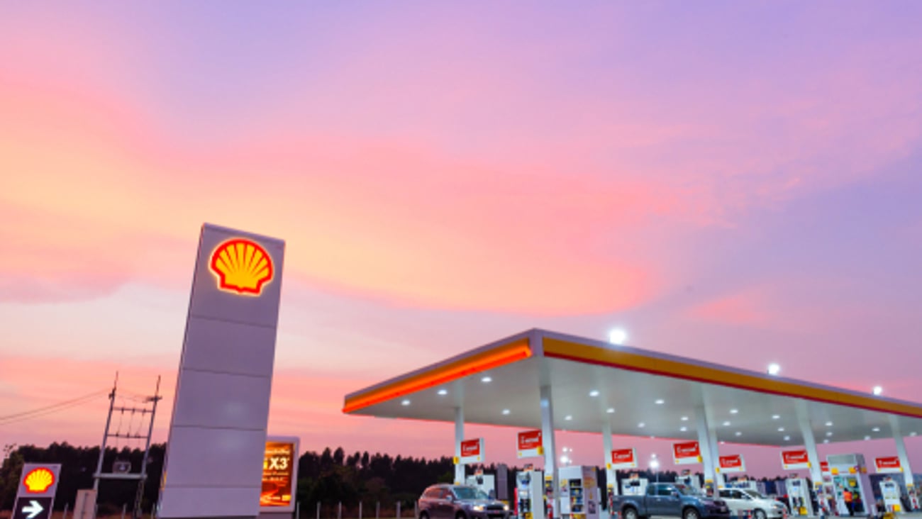 Shell gas station blue sky background during sunset. Royal Dutch Shell sold its Australian Shell retail operations to Dutch company Vitol in 2014