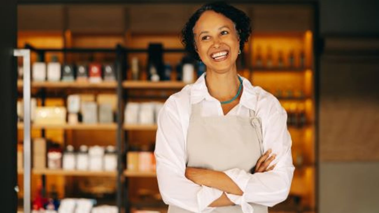 Female Store Owner Stock Image