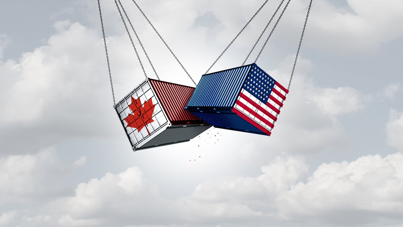 Duelling shipping containers with Canada and US flags