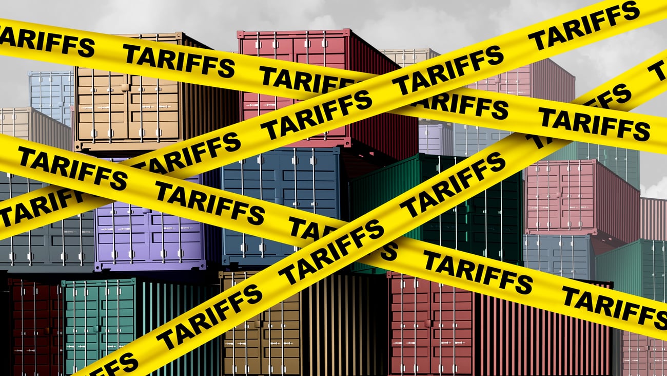 Shipping containers with tariffs caution tape