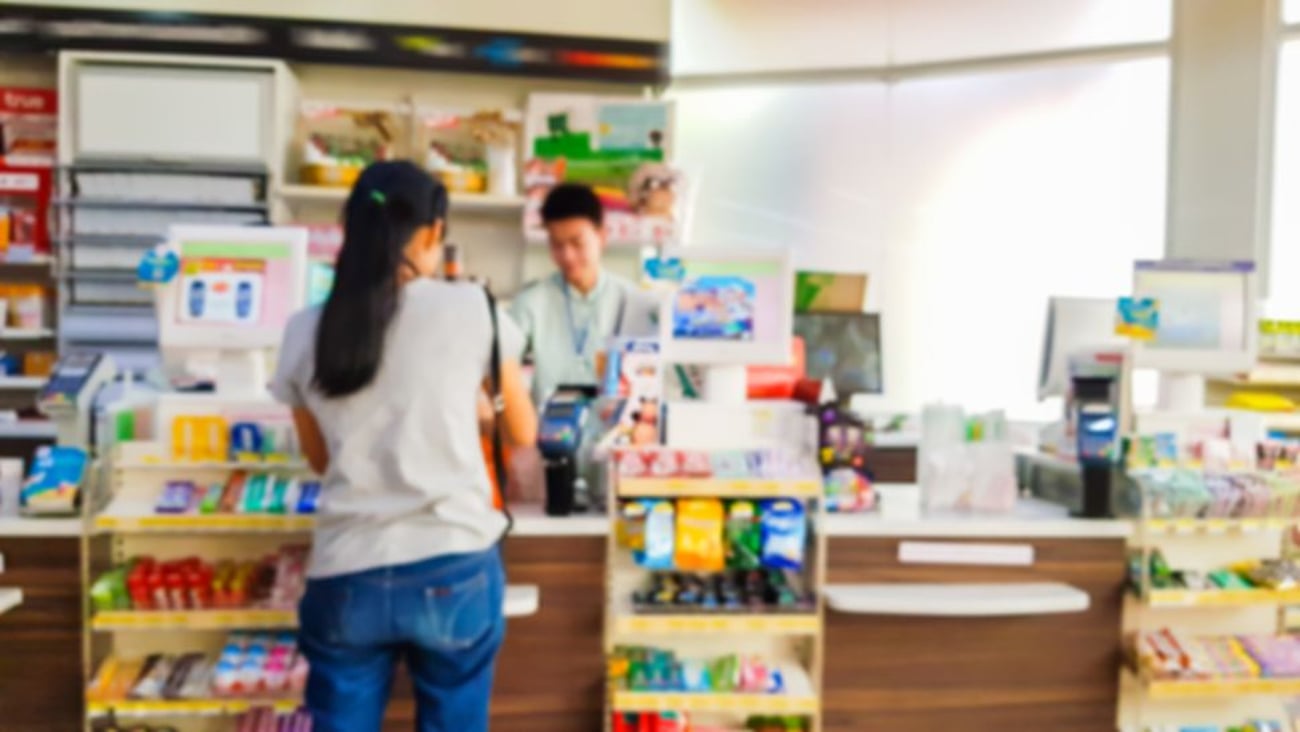 Customer in a convenience store stock image