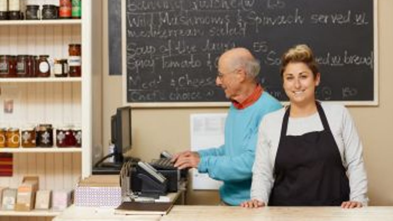 Father and Daughter operating a business stock image teaser