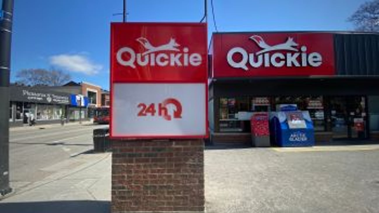 Quickie convenience store exterior signage stock image