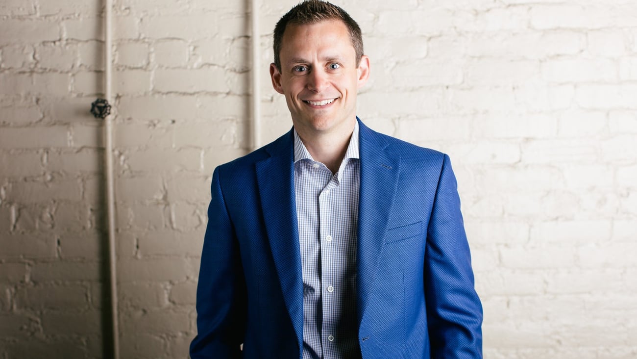 Trevor Grant in a blue suit