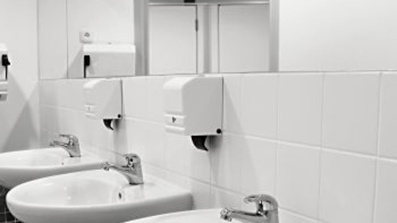 Clean workplace washroom stock image teaser