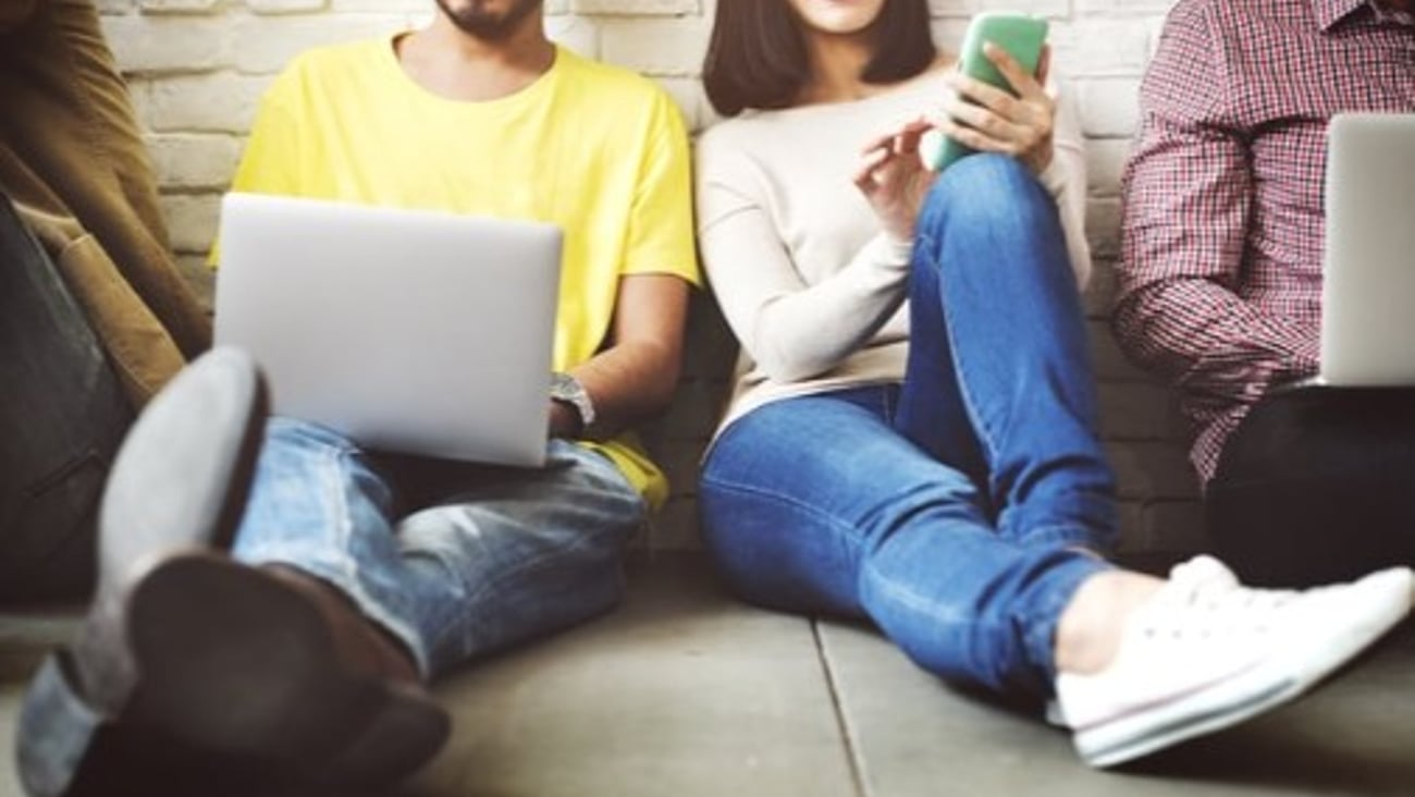 Students on laptops and cell phones