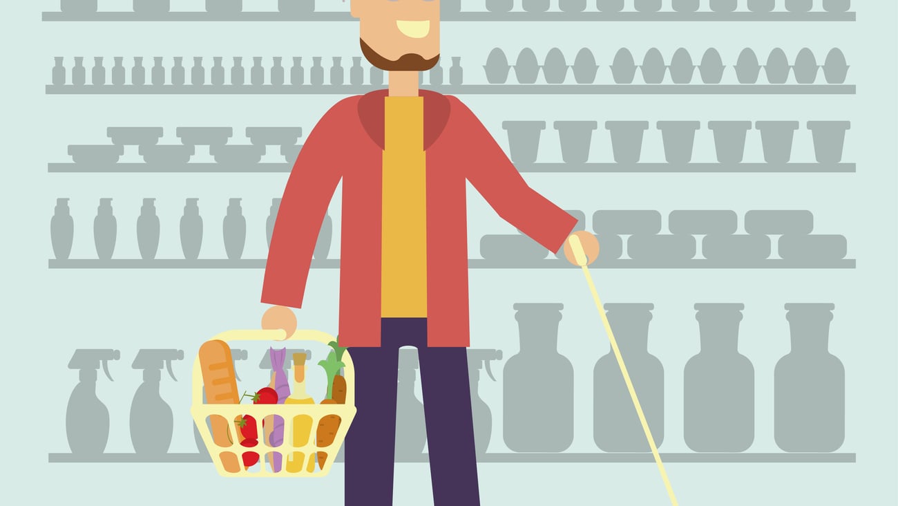 Cool guy with goatee who has impaired vision in a store