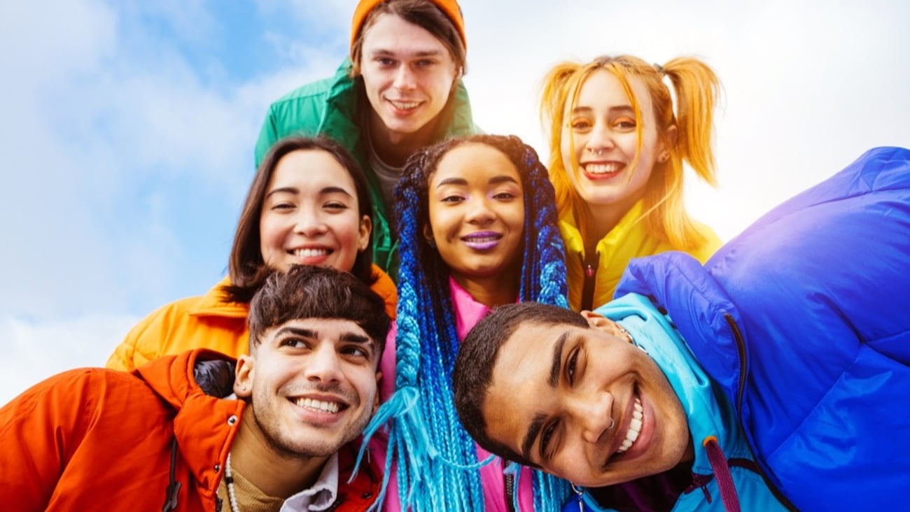 A group of young people smiling