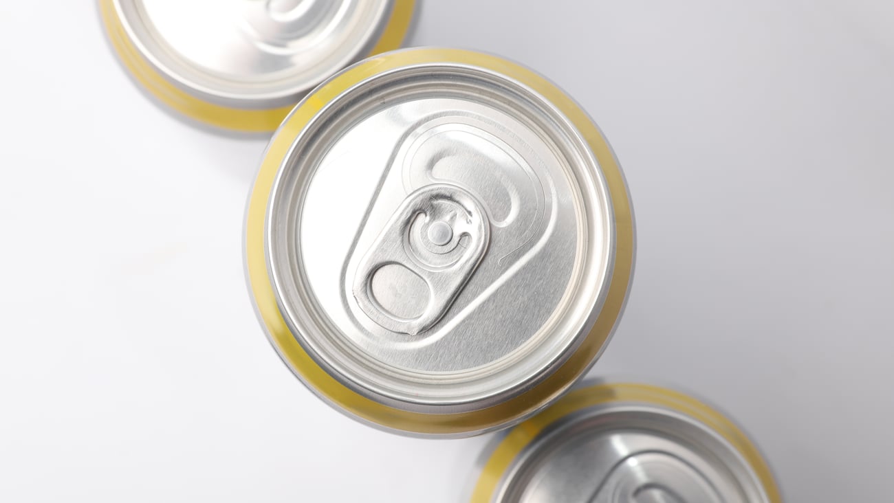 looking down at tops of beer cans with pull tab