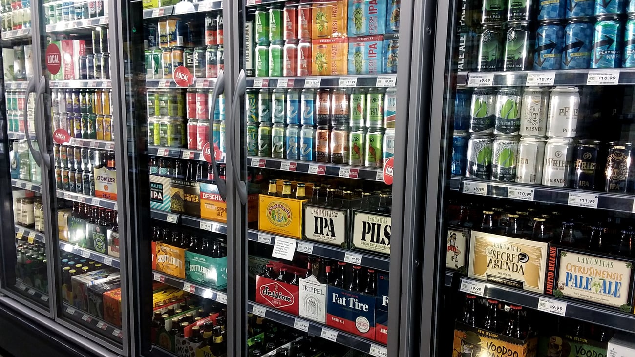 Refrigerated cases of store with ready-to-drink products and beer
