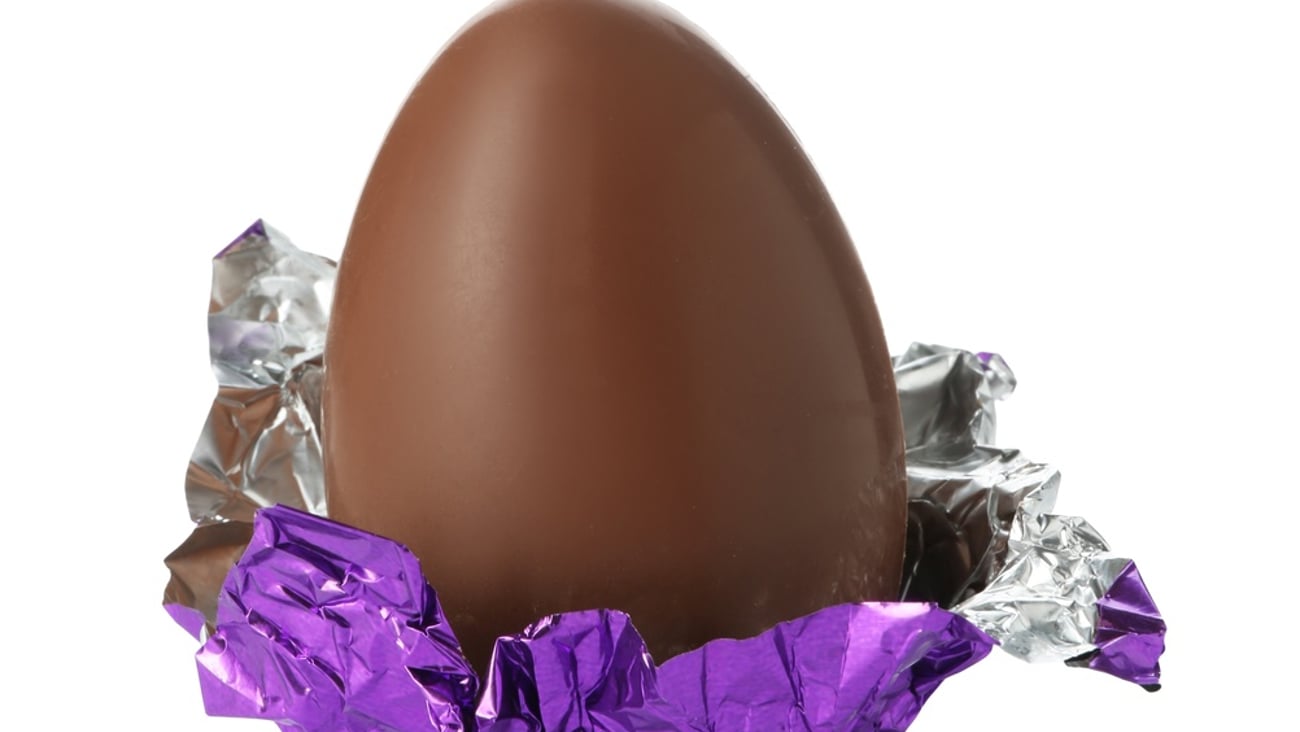 A half-unwrapped chocolate egg
