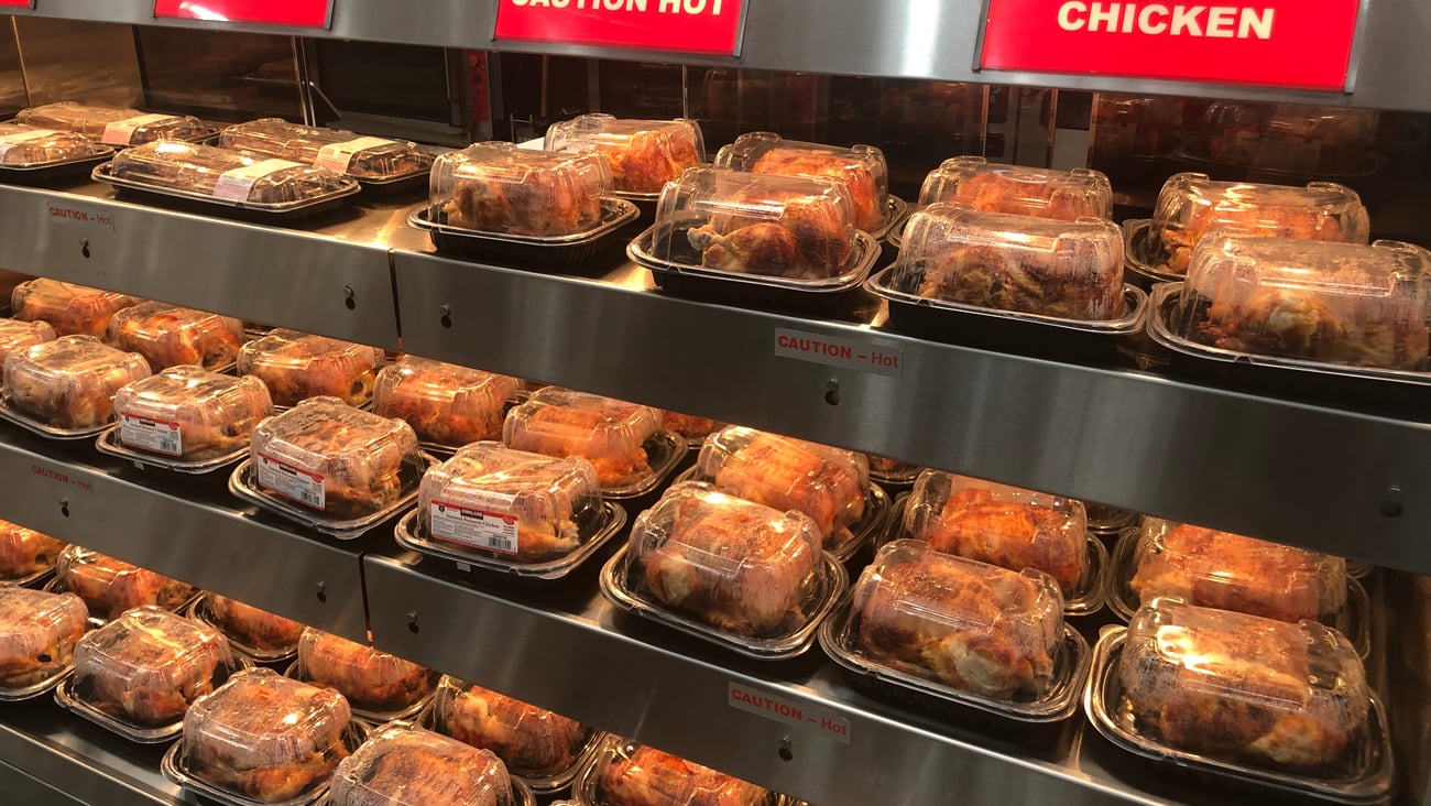 grocery case with rotisserie chickens