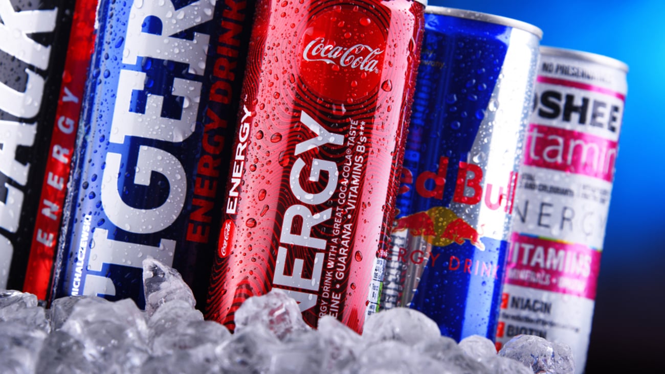 a row of energy drink cans on ice