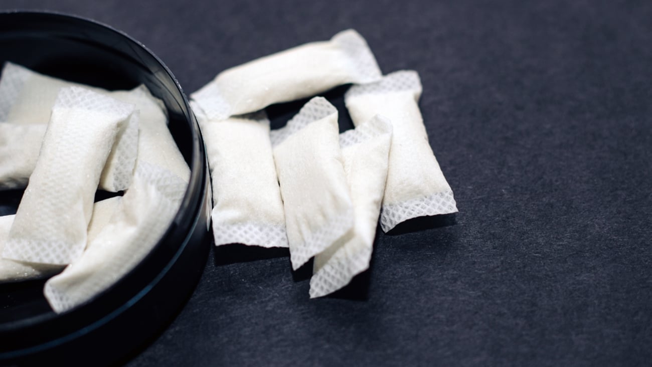 Open tin of nicotine pouches