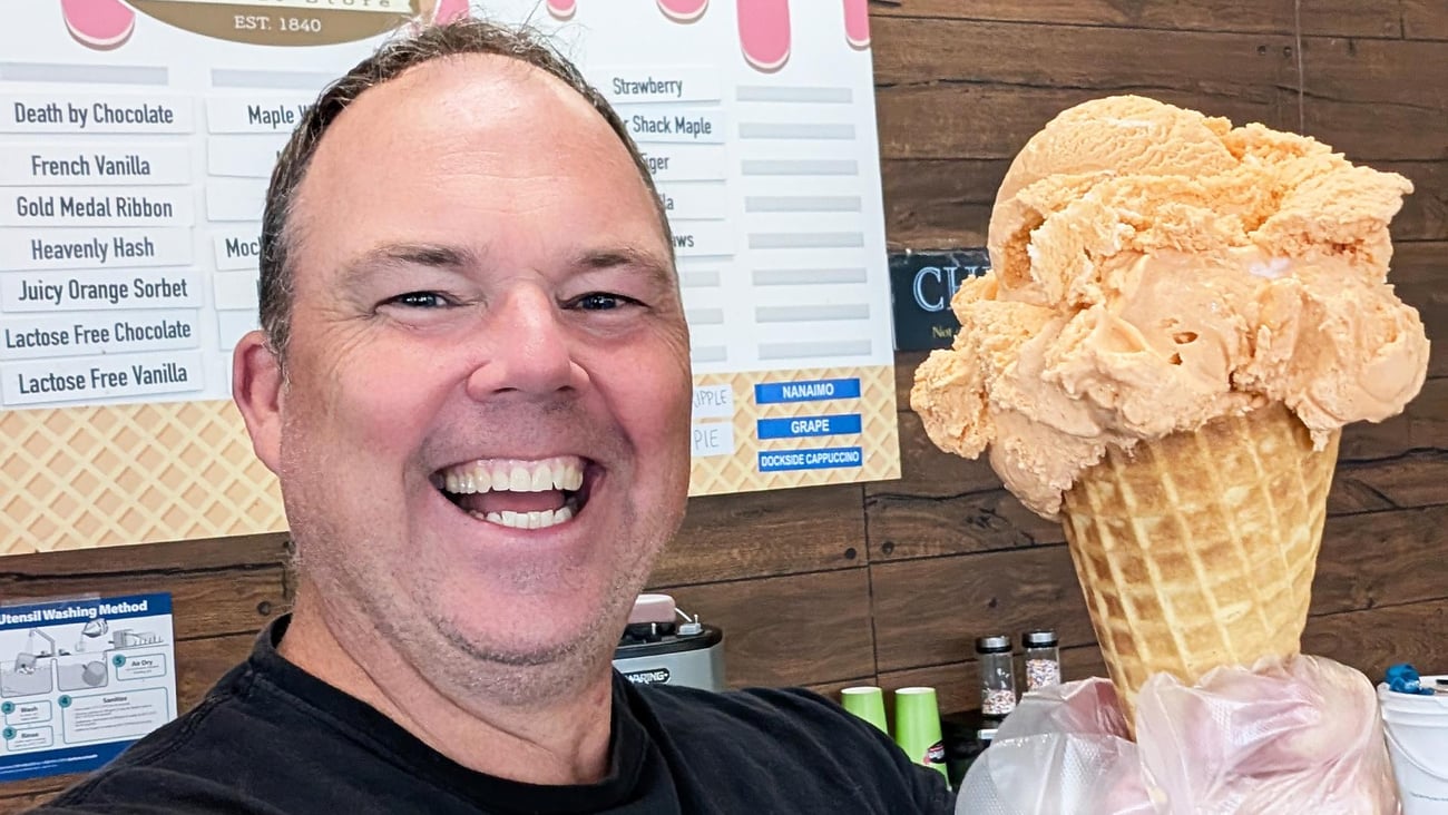 Enniskillen General Stores owner, Thomas Sheehan holding an ice cream cone.