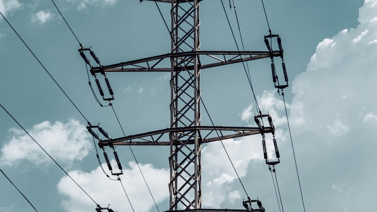 Electrical pylon against a cloudy sky
