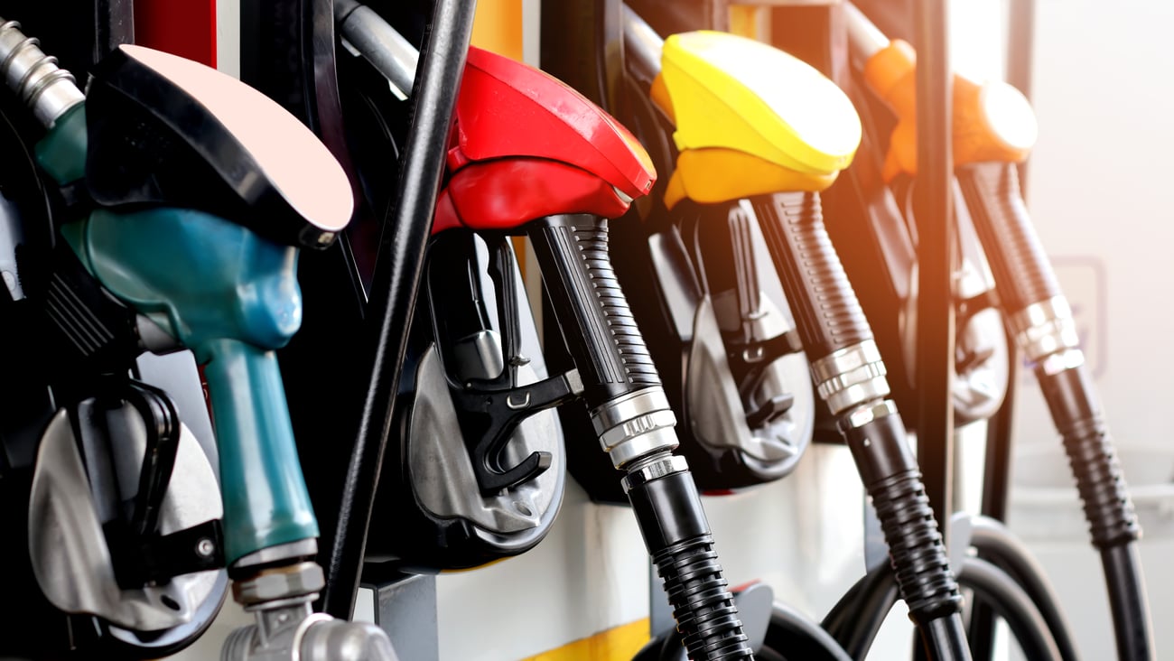 red, green and yellow fuel pumps
