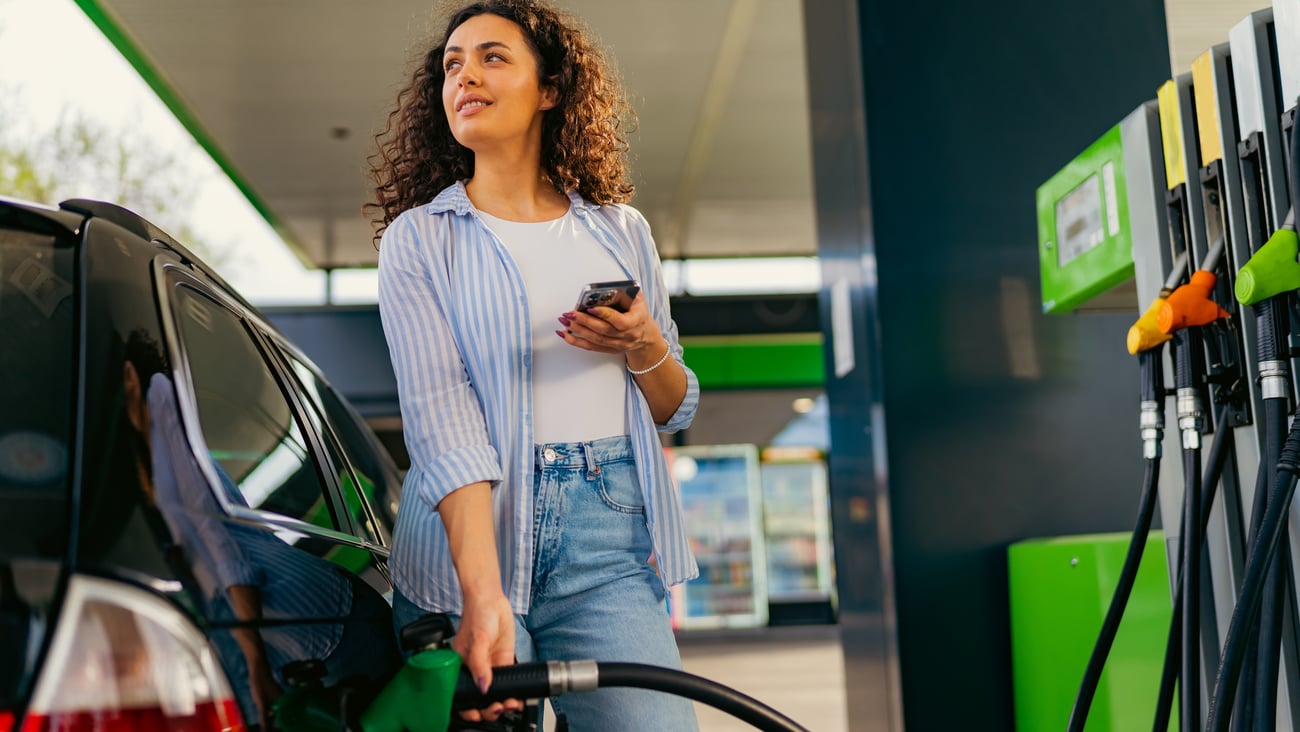 woman at gas pump