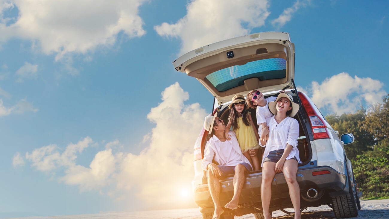 Holiday and travel family concept, Summer vacations . Happy family enjoying road trip with their favorite car. Parents and children are traveling the way to the sea or ocean or river.; Shutterstock ID 1576559980