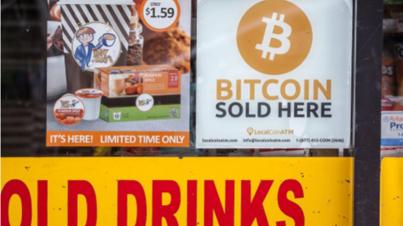 Logo indicating a Bitcoin ATM in a convenience store, from Local Coin ATM. Bitcoin is a cryptocurrency available for buying in physical places