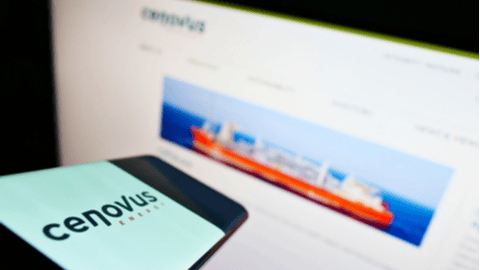 Cenovus logo on a smart phone with website in the background