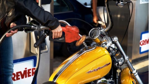 motorcycle in front of Crevier gas pump