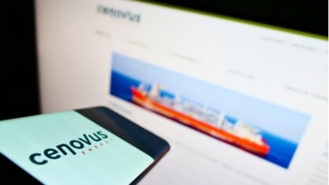 Cenovus logo on a smart phone with website in the background