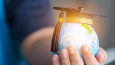 Education in Global world, Graduation cap on Businessman holding Earth globe model map with Radar background in hands. Concept of global business study, abroad educational, Back to School.