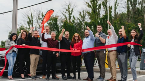 Cutting the ribbon on the new EV charging station in Quebec. 