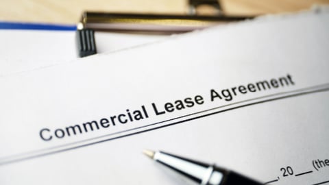 Legal document Commercial Lease Agreement on paper.