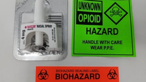 Naloxone spray with warning labels. Naloxone is sold under the brand name of Narcan and is used to treat overdoses from heroin, Fentanyl, and opiates.