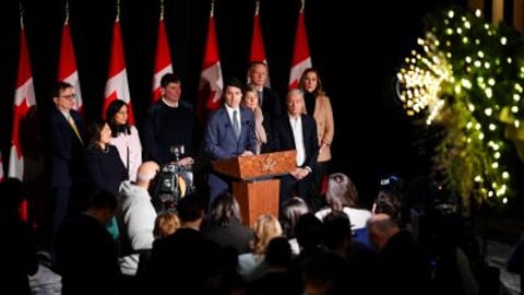 Prime Minister Justin Trudeau stands with members of his cabinet teaser