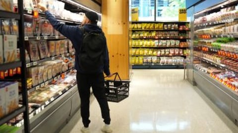 Male Shopper in a grocery aisle teaser