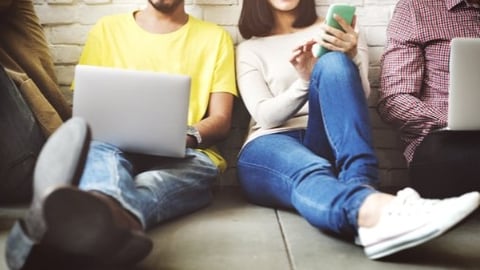 Students on laptops and cell phones