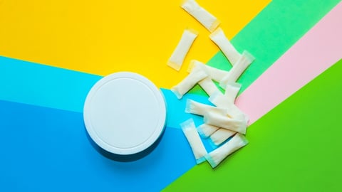Nicotine Pouch against a colourful background