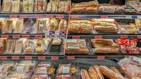 refrigerated shelf of ready to go sandwiches and snacks