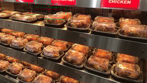 grocery case with rotisserie chickens