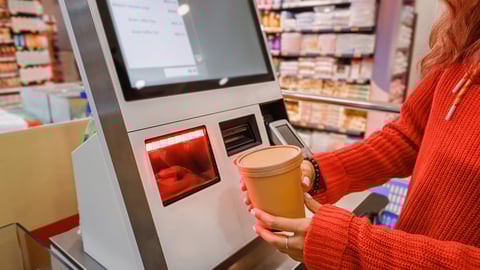 Woman scanning carton at store
