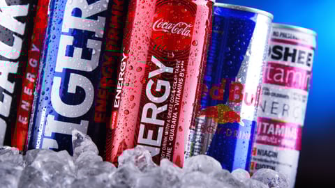 a row of energy drink cans on ice