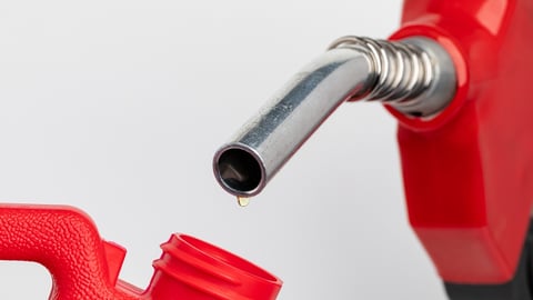 fuel pump dripping a single drop of oil into a jerry can