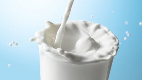 Milk being poured into a glass