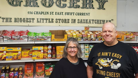 Wendy and Eldon Campbell in front of their Elmwood Grocery counter