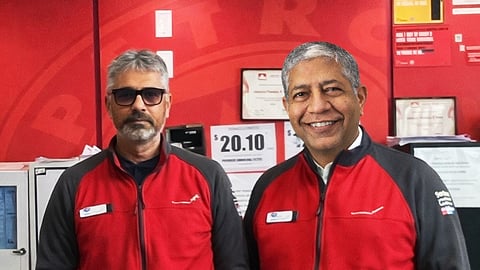 Udayan Pandya and Ketan Dave in front of their counter at the Green Mountain Petro-Canada